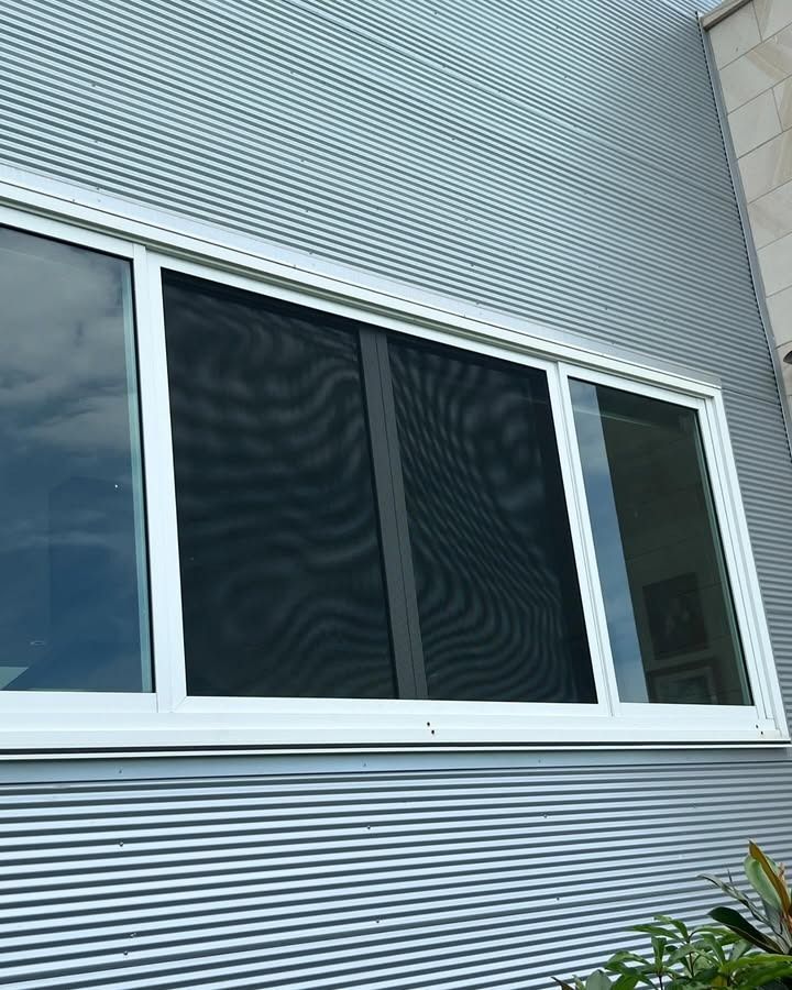 A Window With A Screen On It Is On The Side Of A Building — Glass 24/7 In Tuncurry, NSW