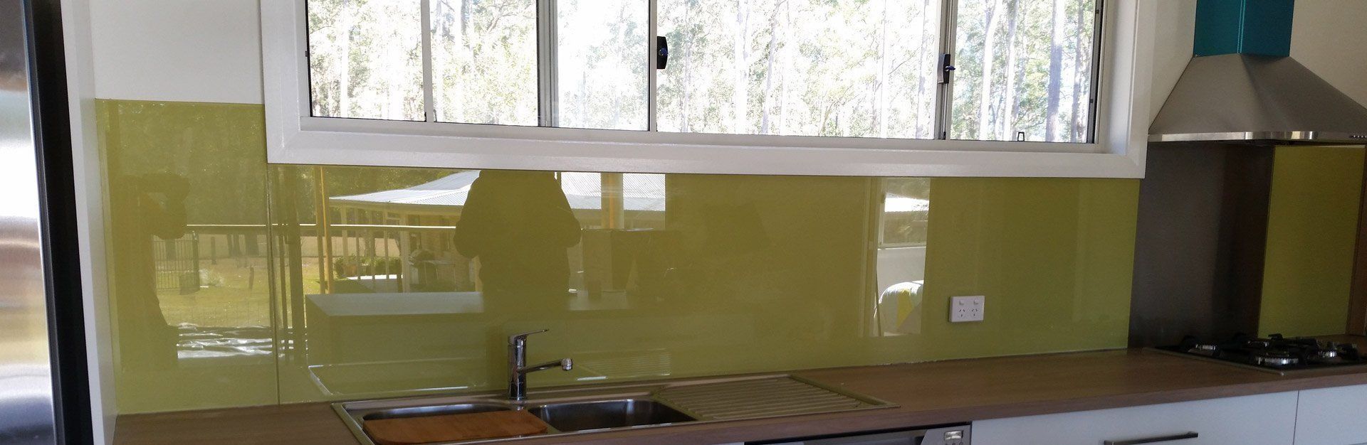 A Kitchen With A Sink , Stove , And Window — Glass 24/7 In Old Bar, NSW
