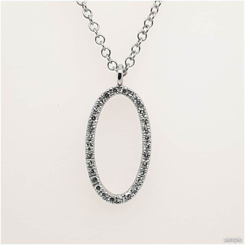 Silver necklace with an oval pendant outlined in small, sparkling stones.