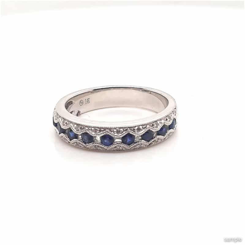 Silver ring with blue sapphires set in a geometric pattern.