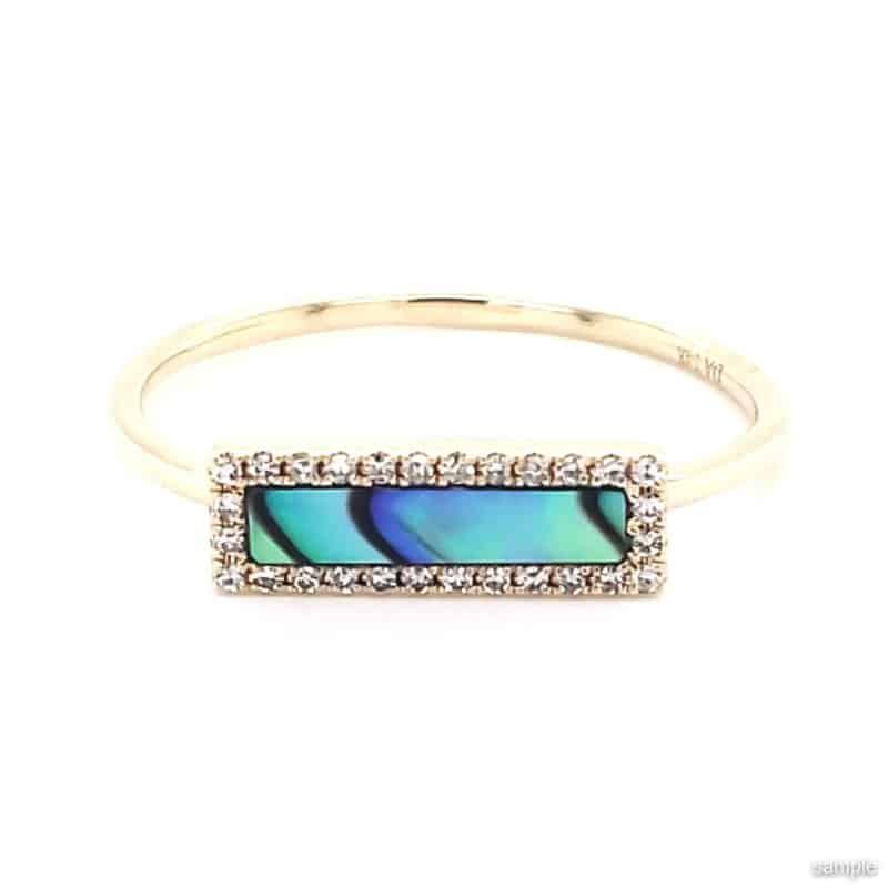 Gold ring with rectangular abalone shell inlay, surrounded by small diamonds.