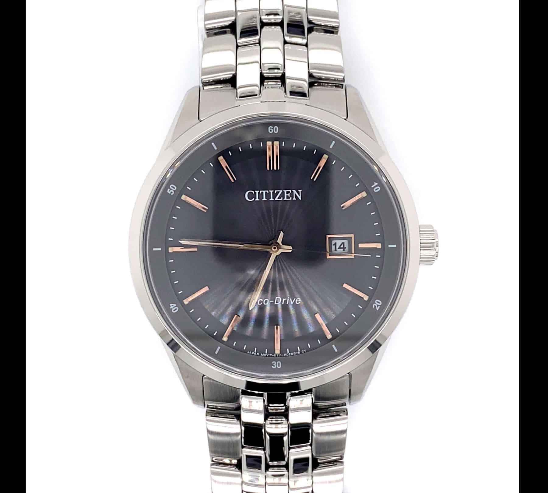Silver Citizen Eco-Drive watch with a black dial, rose gold accents, and a date window.