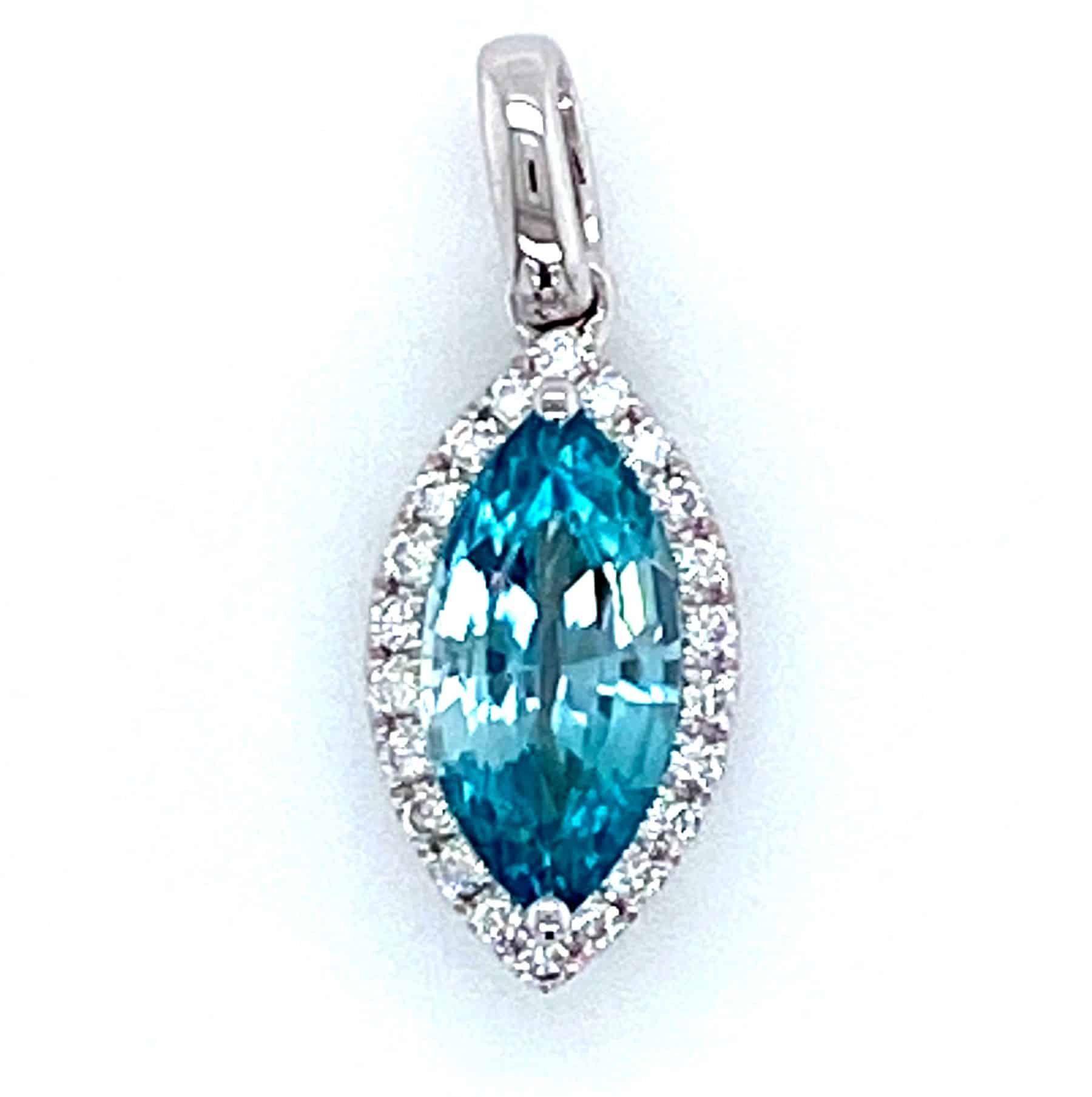 Blue gemstone pendant with diamond halo, set in white metal.