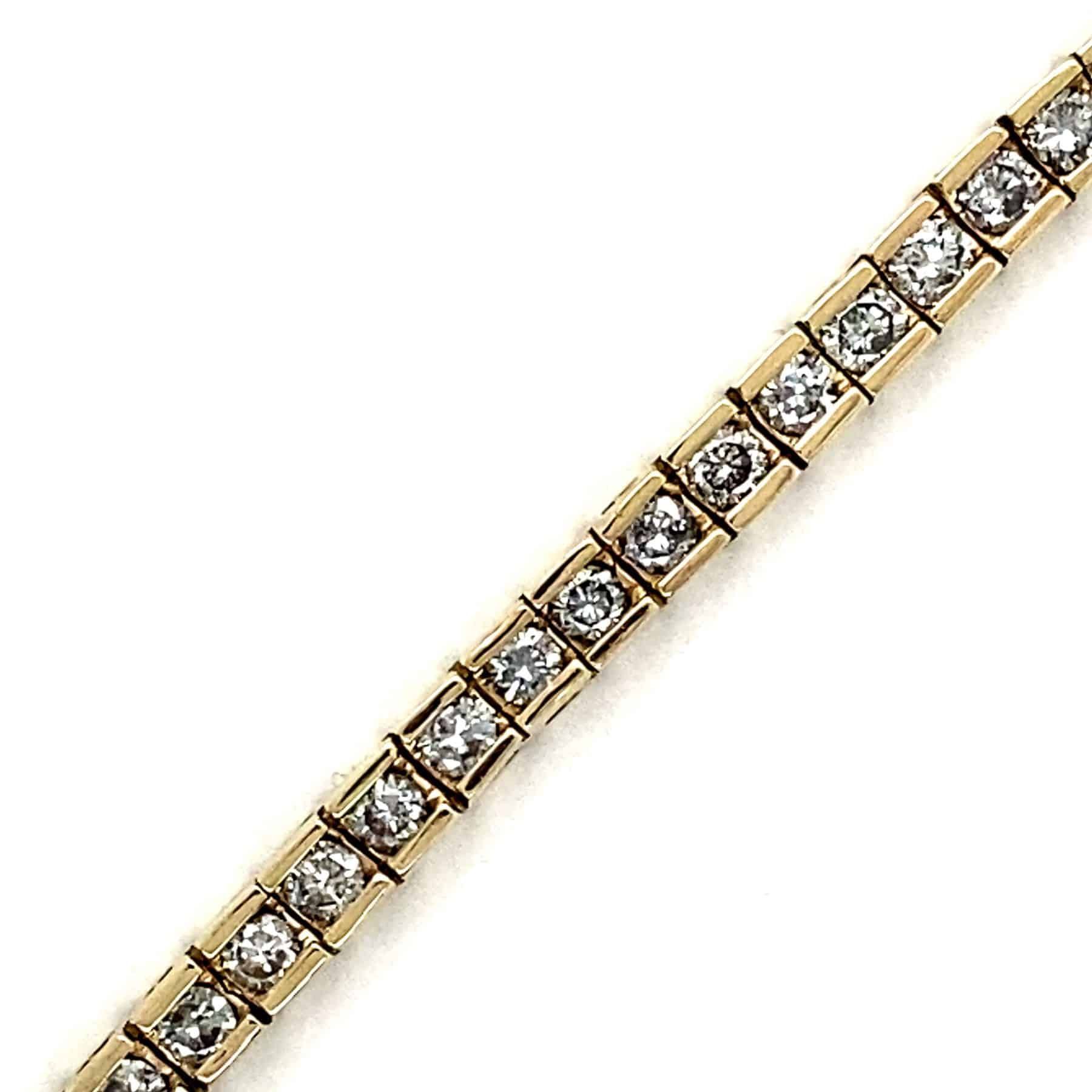 Gold bracelet with square-set clear stones.