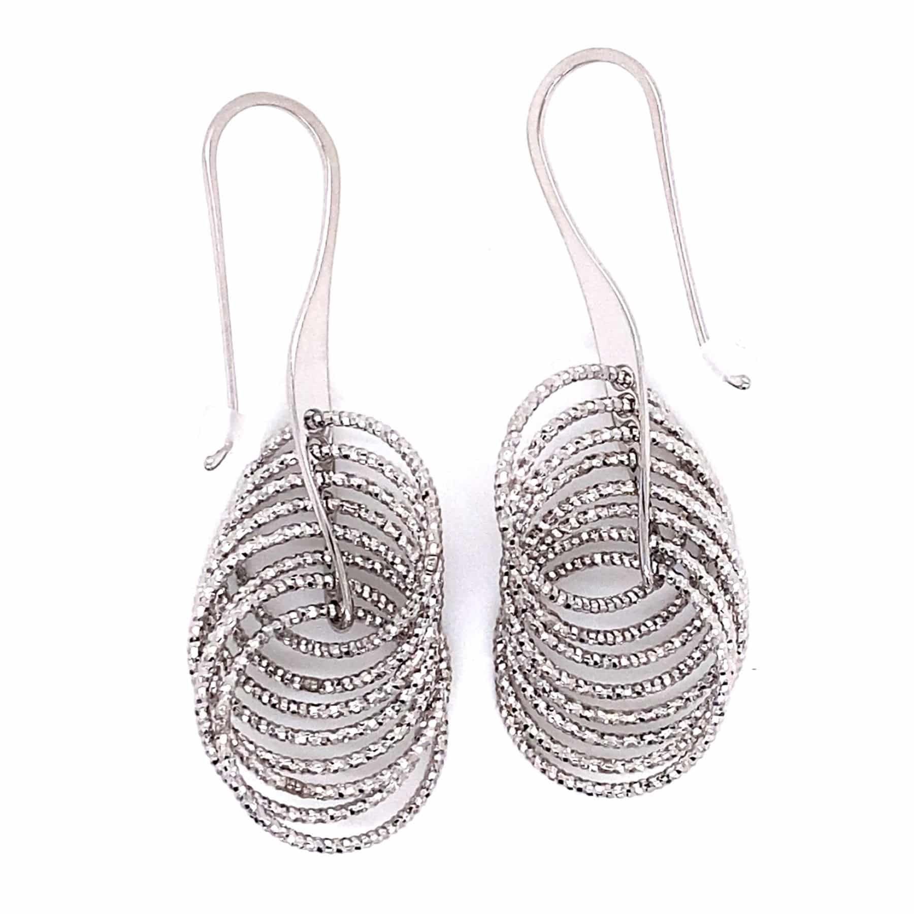 Silver earrings with multiple intertwined oval loops hanging from ear wires.
