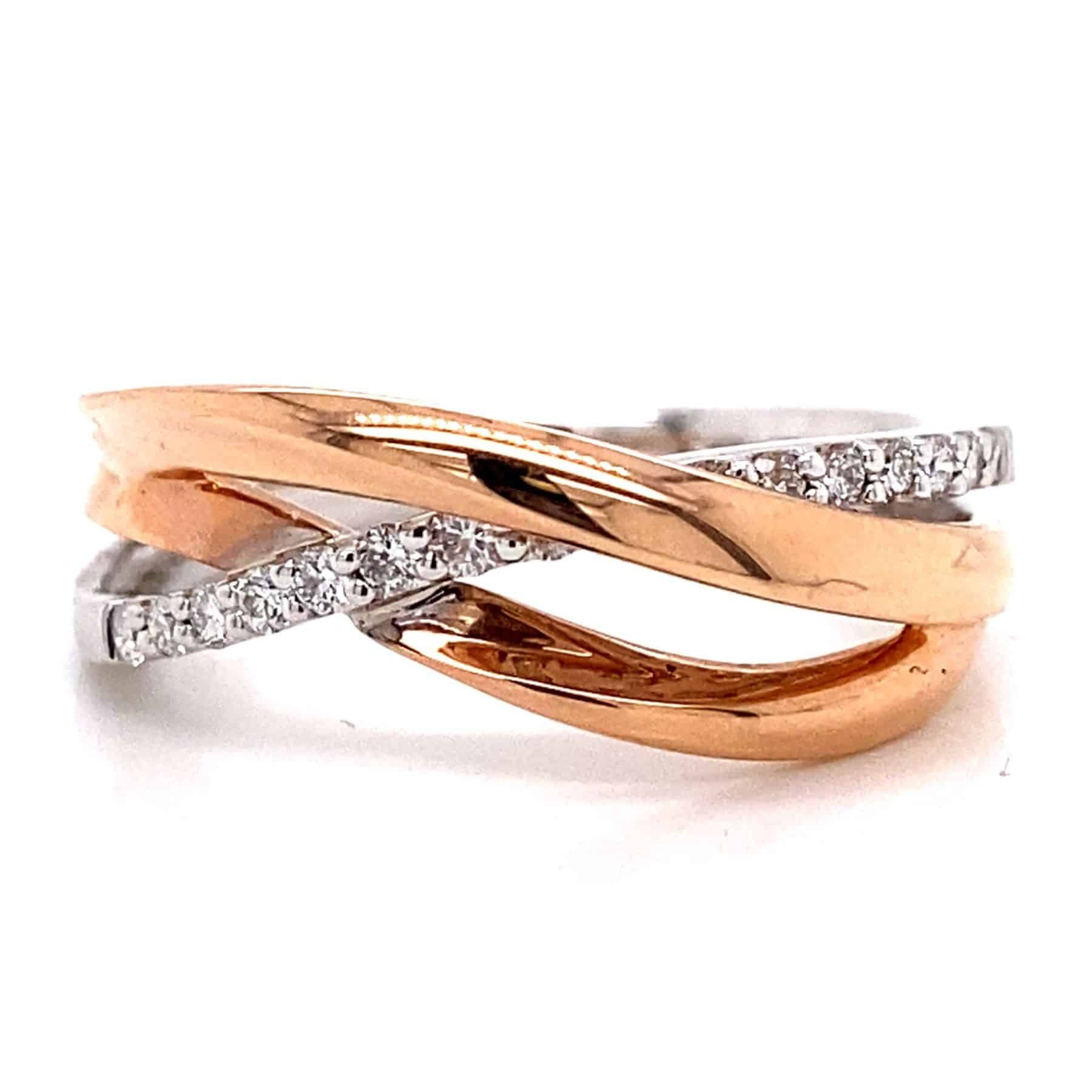 Two-tone ring in rose gold and white gold with crisscrossing bands, one lined with small diamonds.
