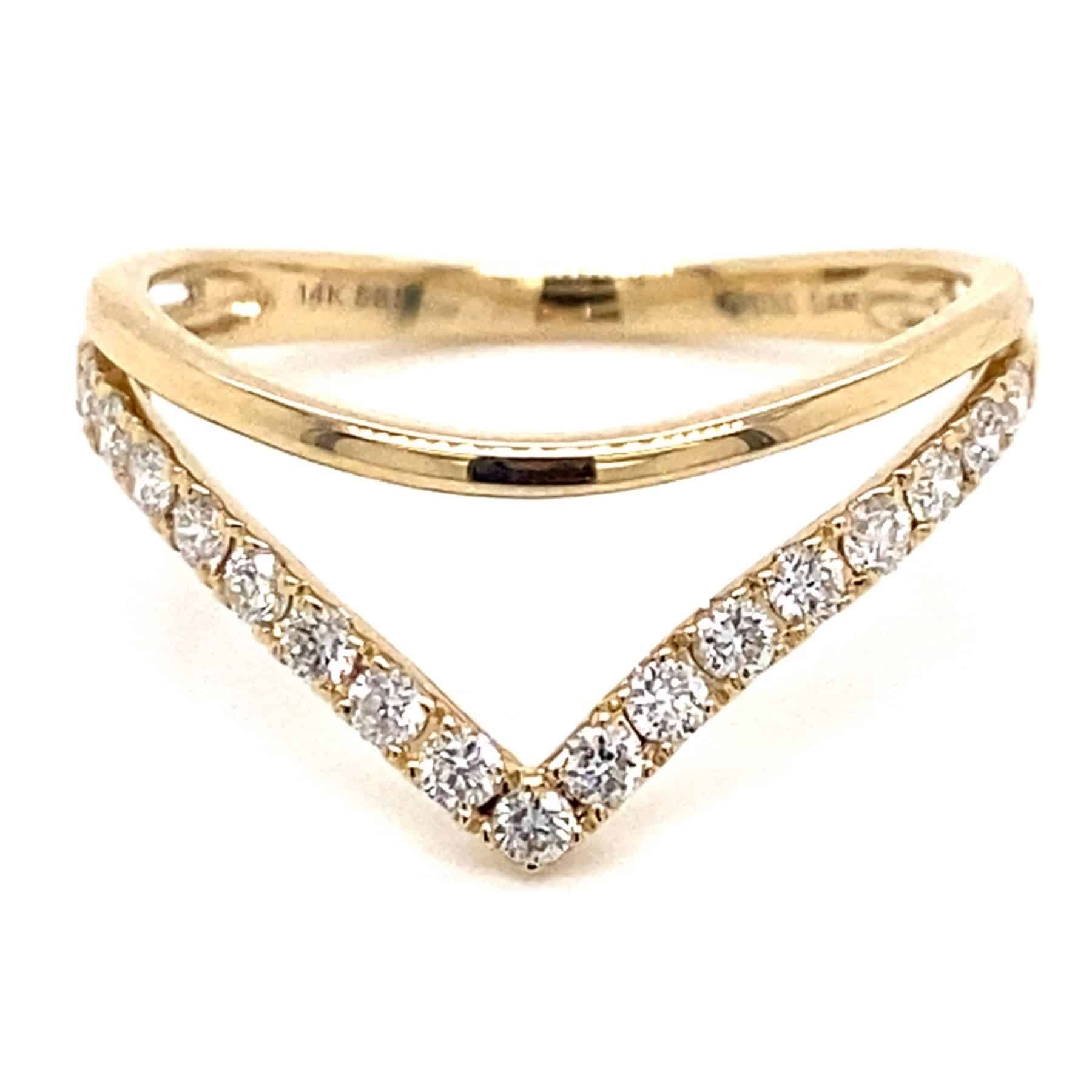 Gold chevron ring with small diamonds.