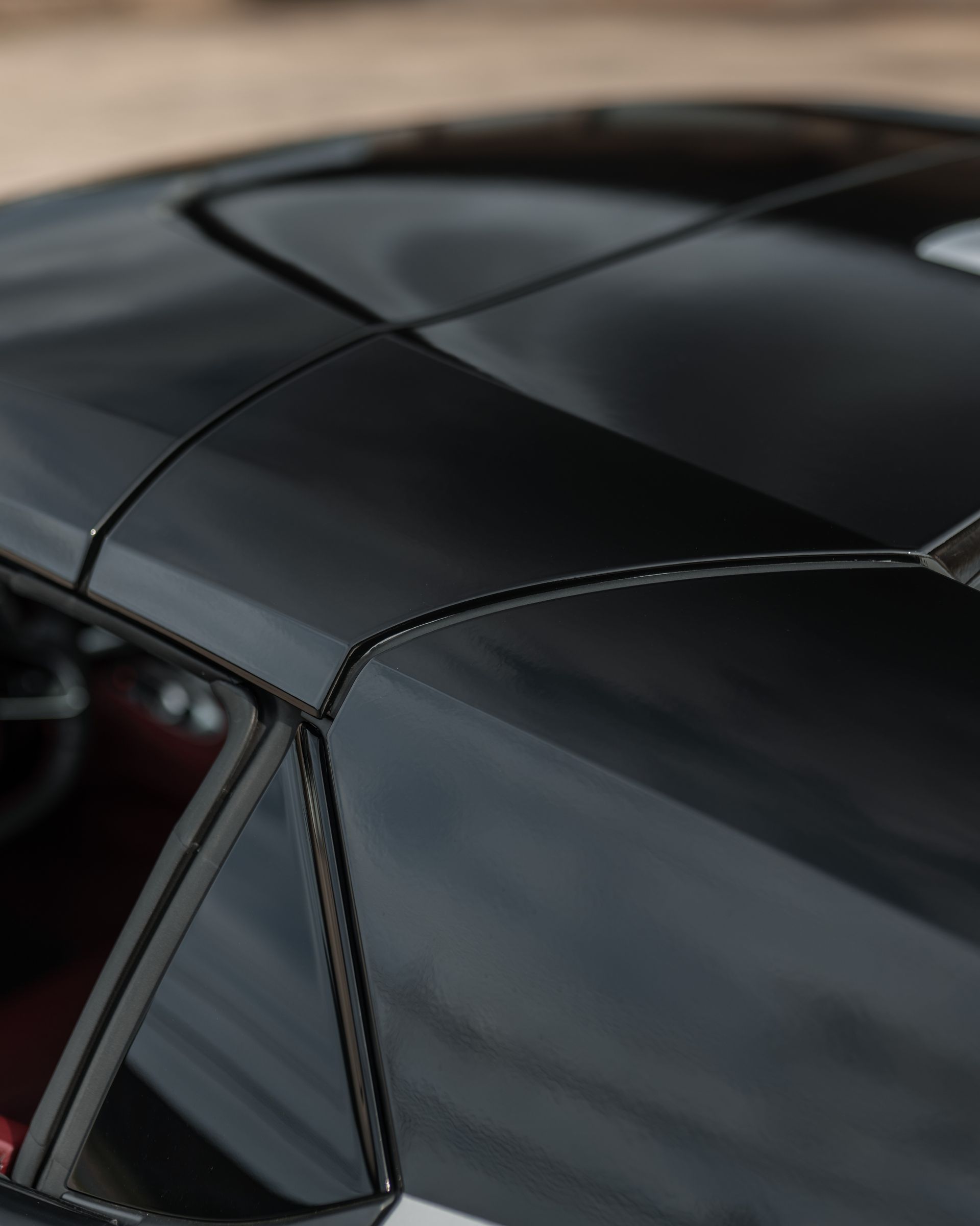 A close up of the roof of a black car