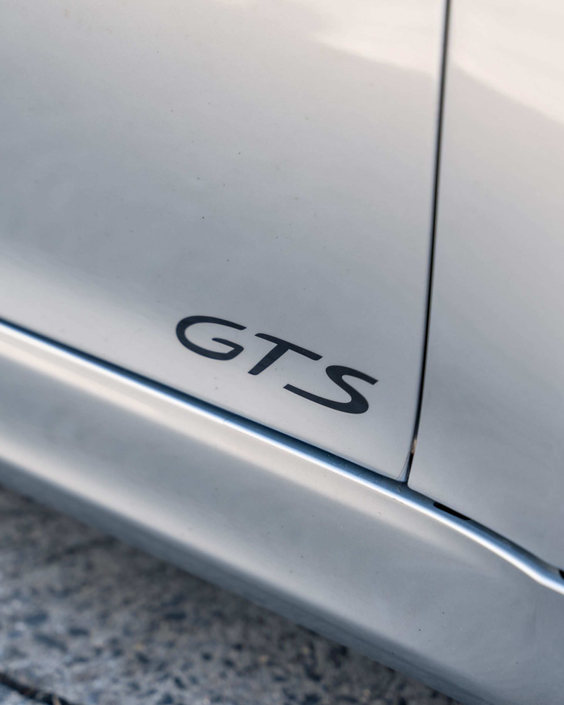 The word gts is on the side of a car