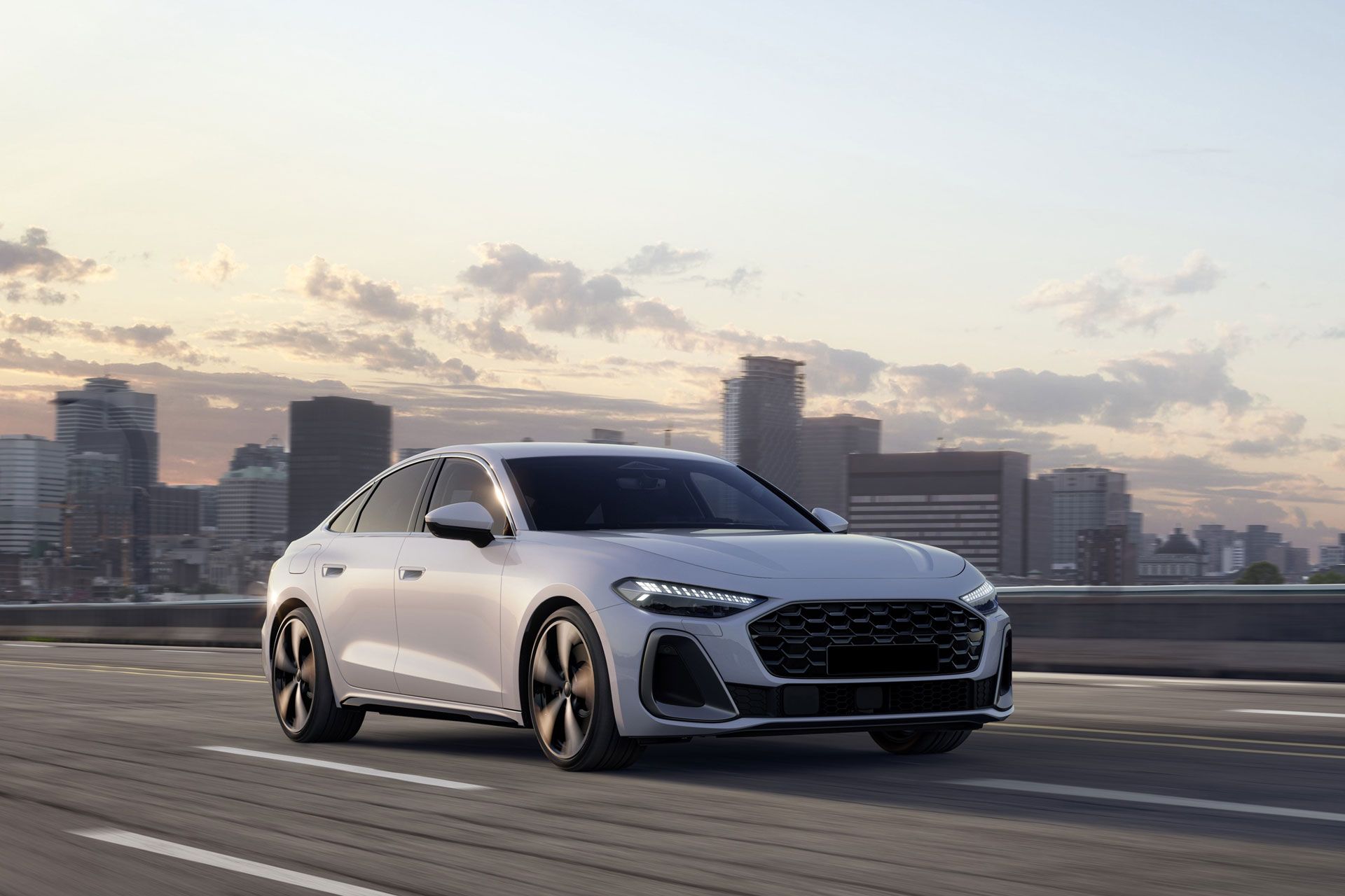White Audi sedan driving on a road, city skyline background at sunset.