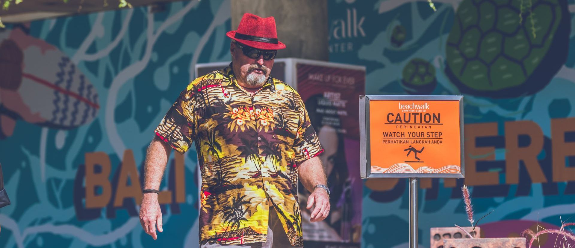 man wearing hawaiian shirt