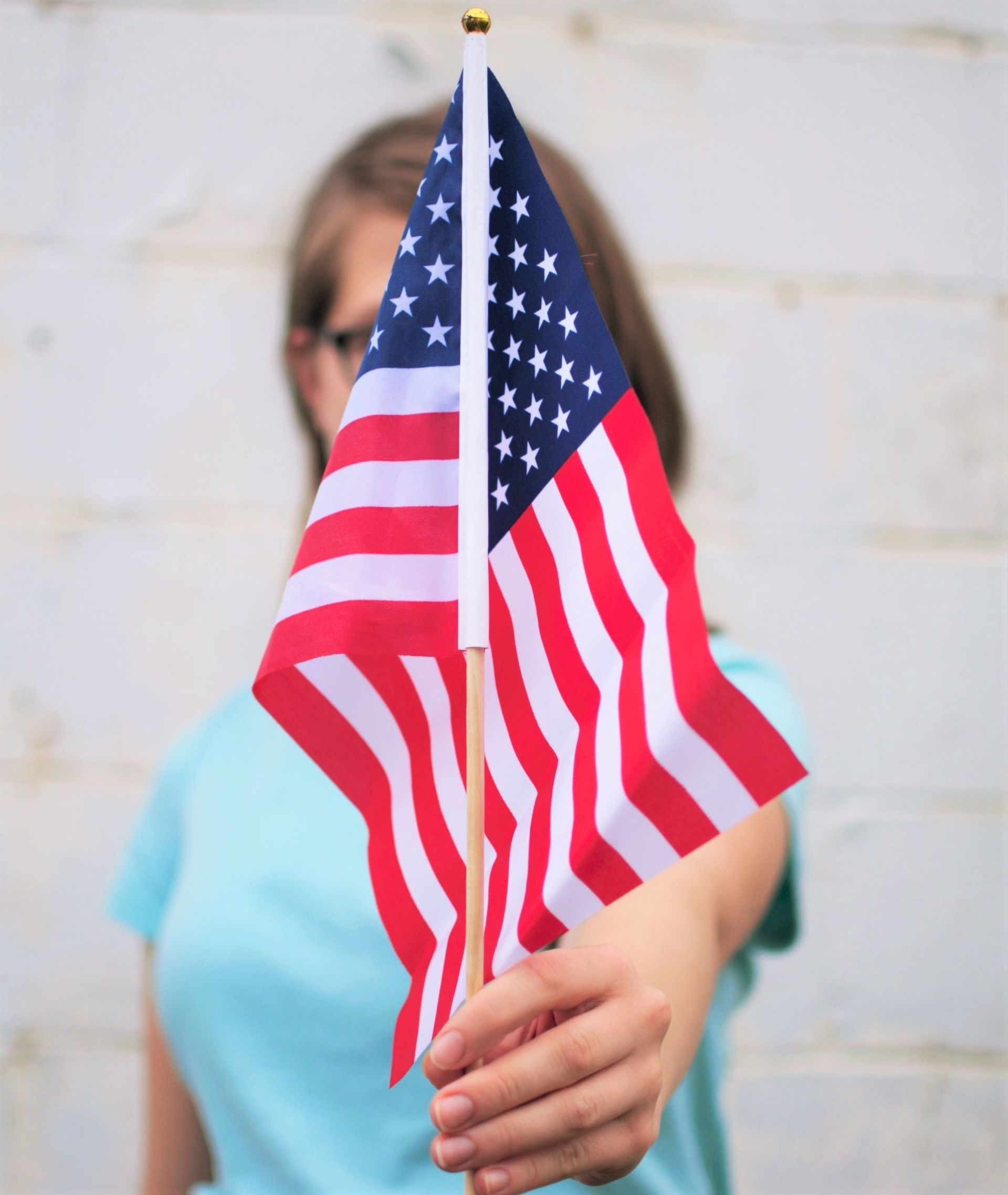 woman holding american flag