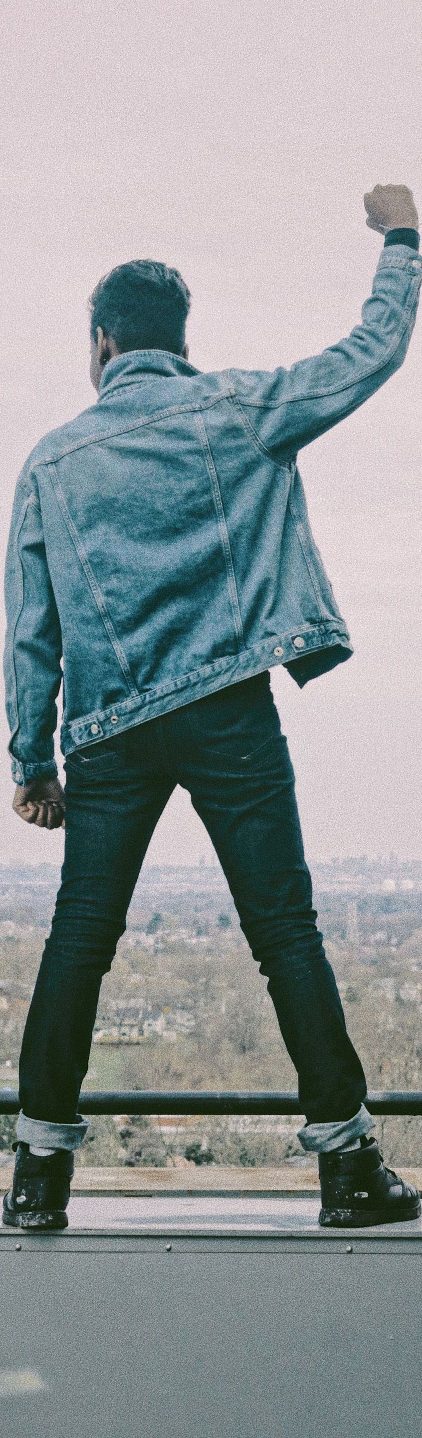 man wearing denim jacket