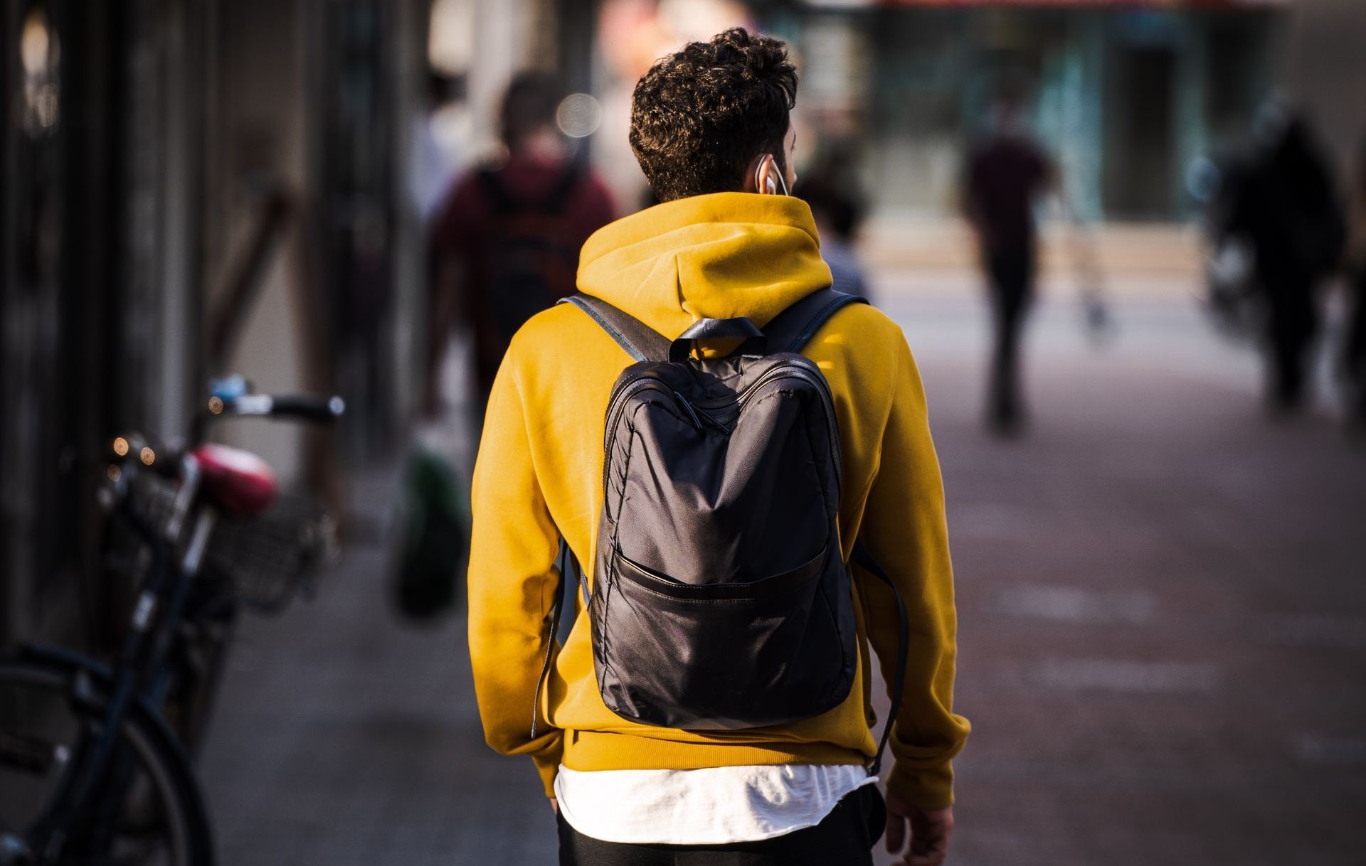 man in yellow hoodie