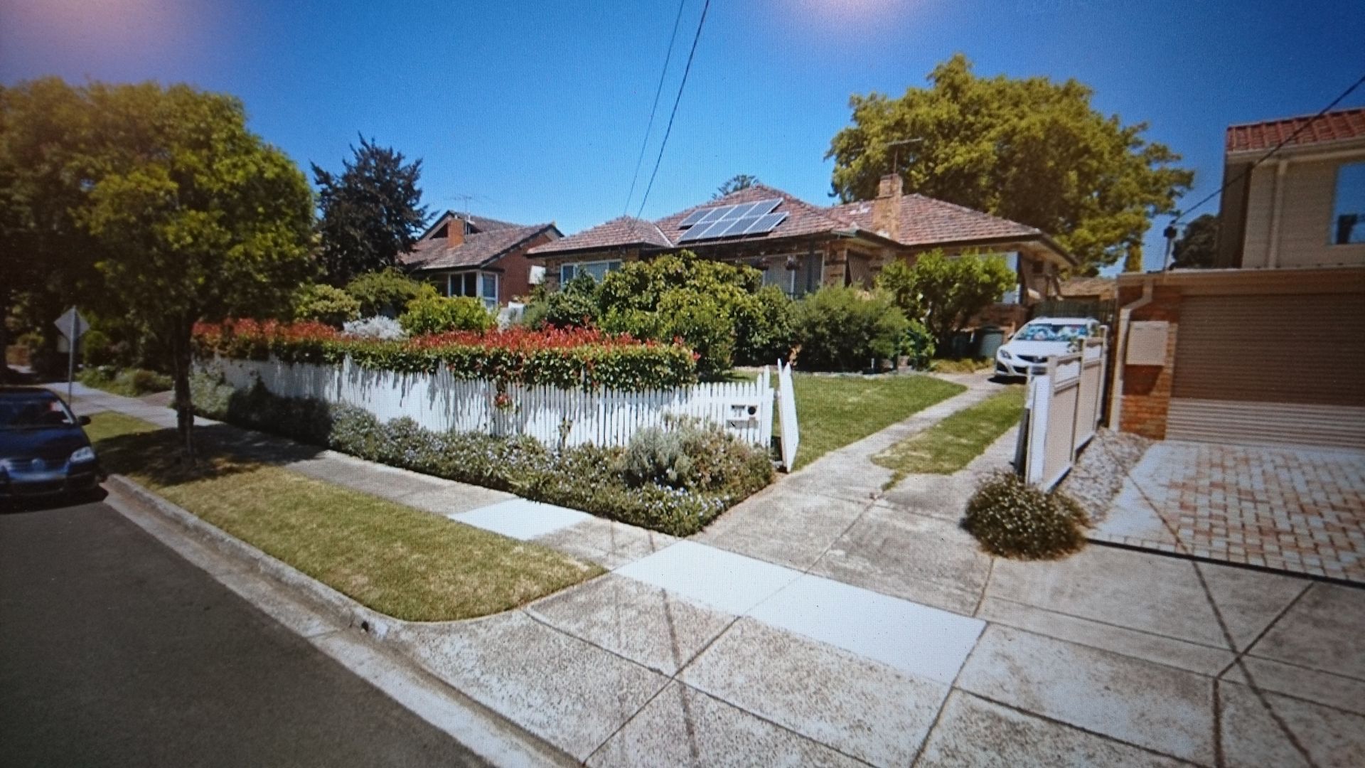 a house with a lot of trees in front of it
