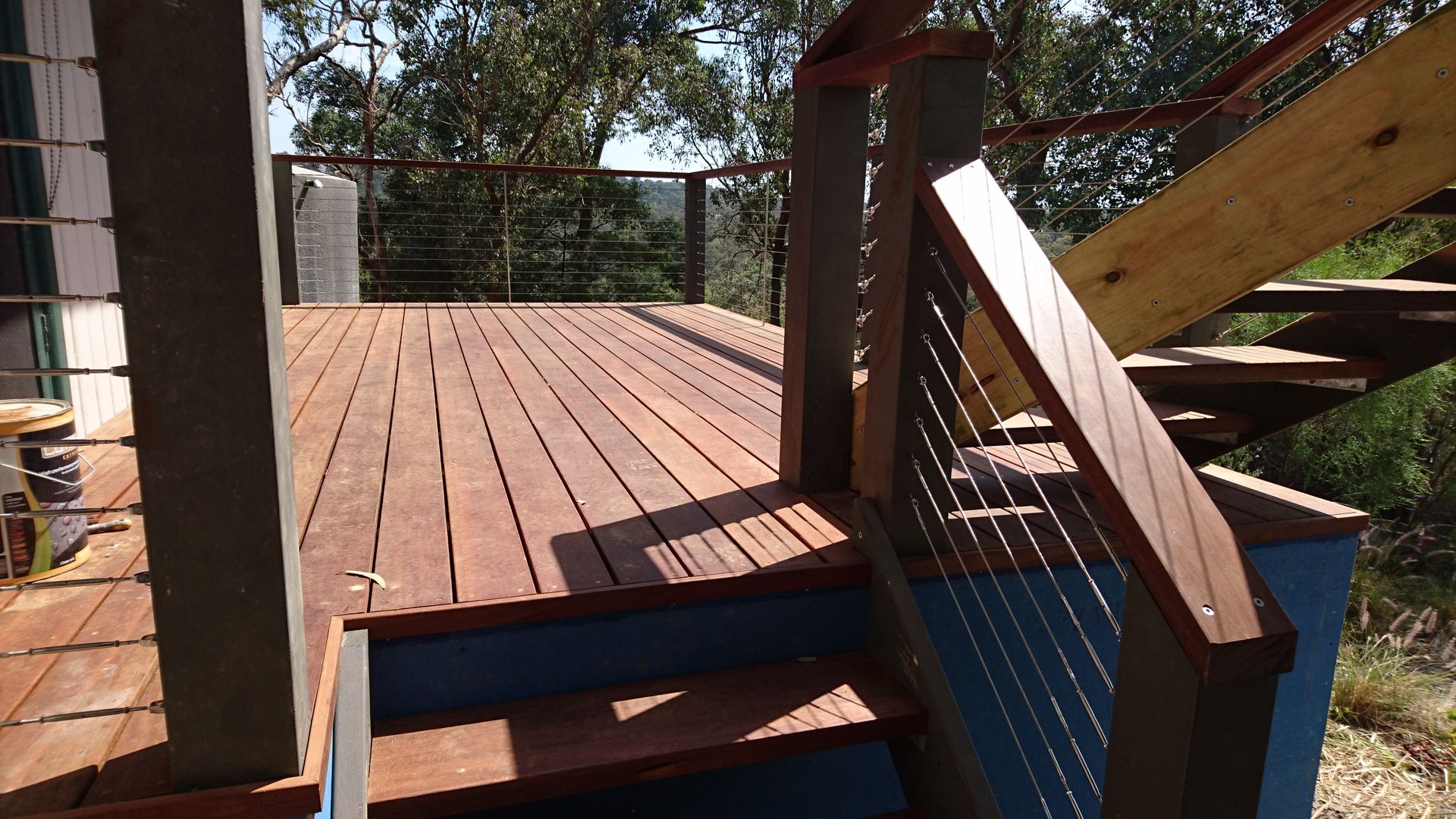 a wooden deck with stairs leading up to it