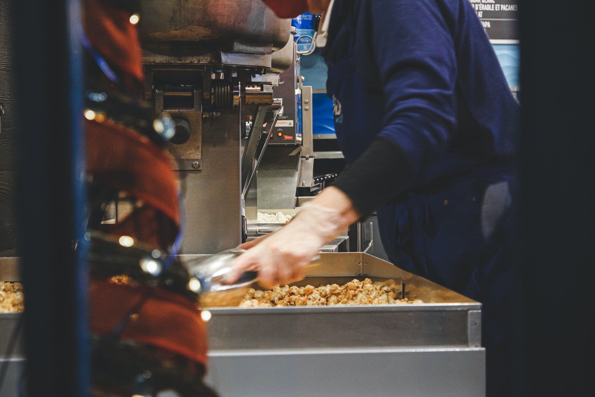 Worker manufacturing popcorn in a factory