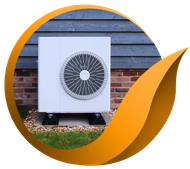 White heat pump unit against brick and wood siding.