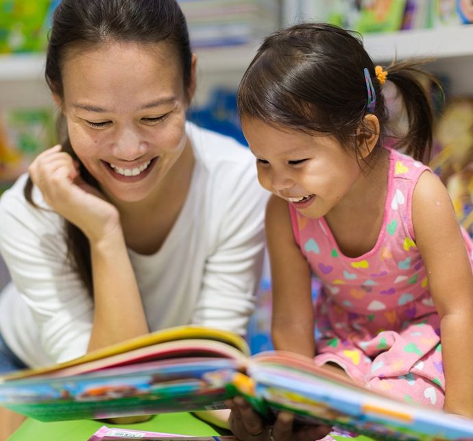 Teacher Reading Book With A Kid — Redondo Beach, CA — Carden Dominion School