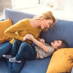 Mother and Her Son Playing on The Sofa — Gilbert AZ —  All State Carpet & Tile Care