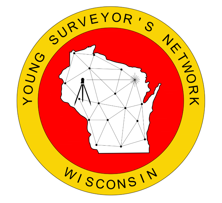 An aerial view of a bulldozer driving through a dirt field.