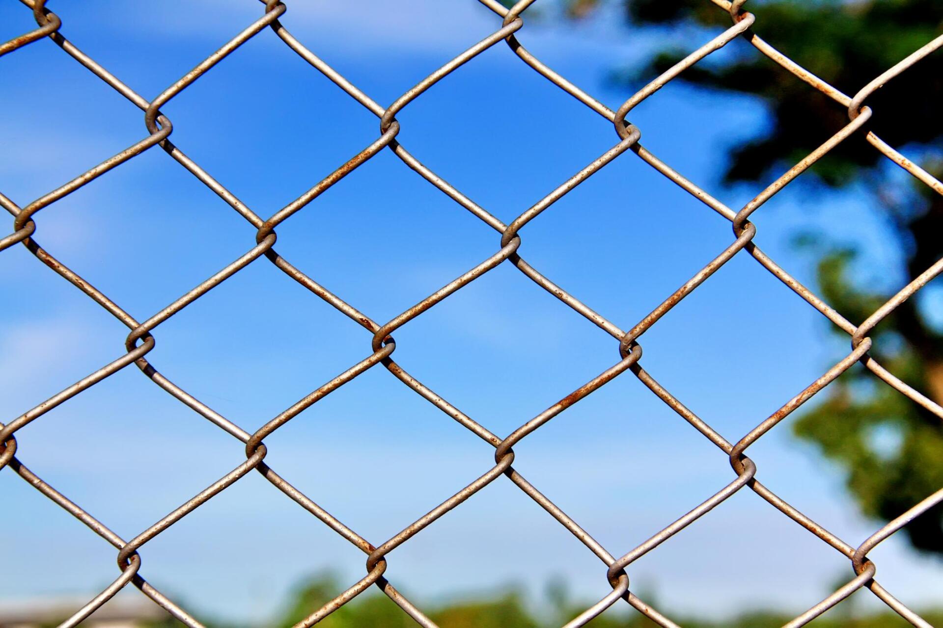 a metal chain link fence