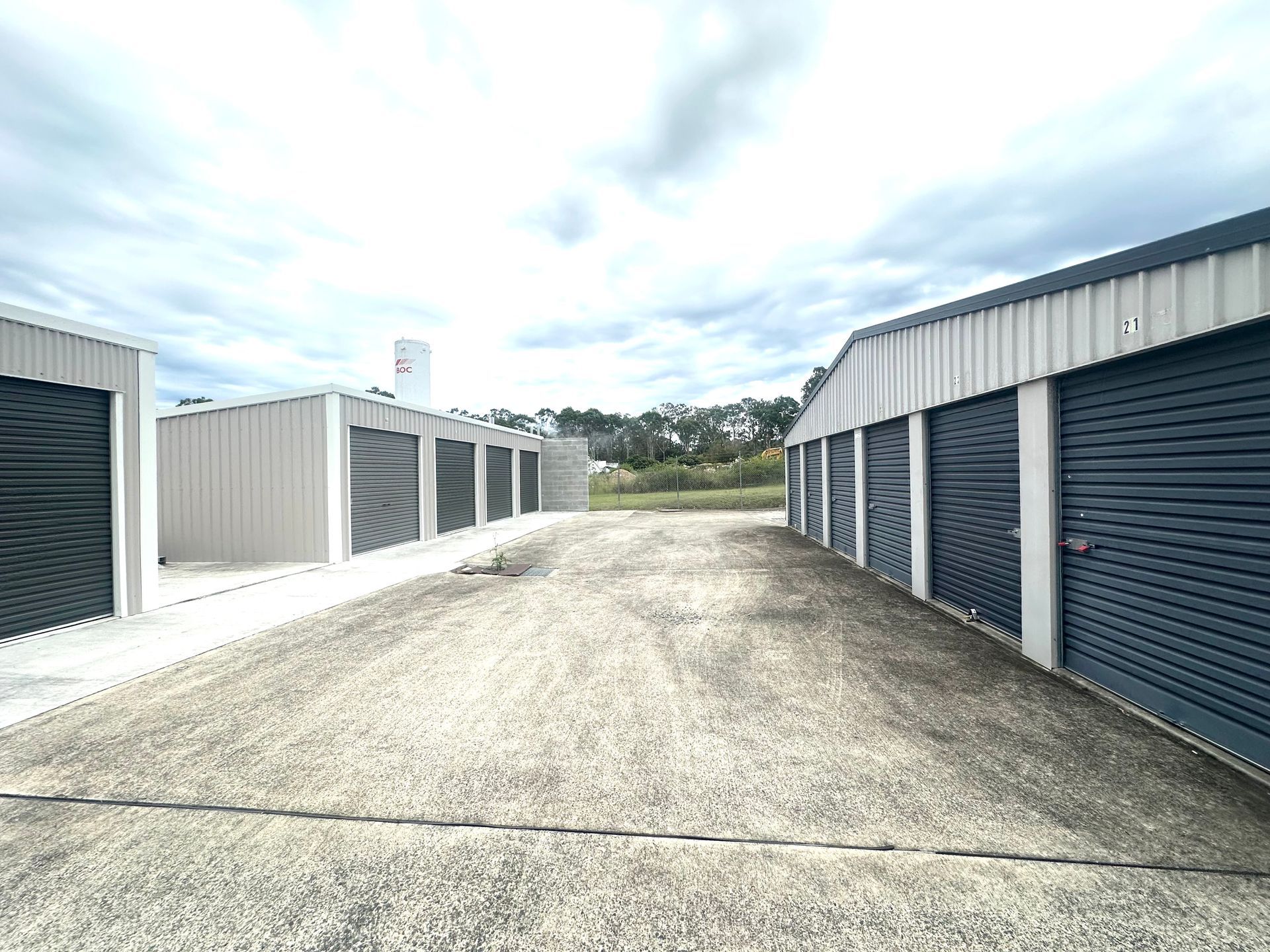 A row of storage units lined up next to each other on a dirt road. — Coolabah Self Storage In Taree, NSW