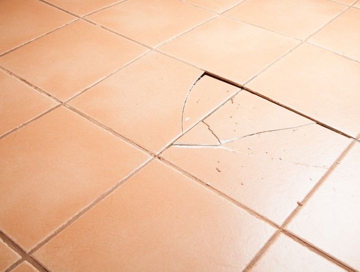 Derbyshire Tiling Specialists removing broken tiles before replacing them in Derby