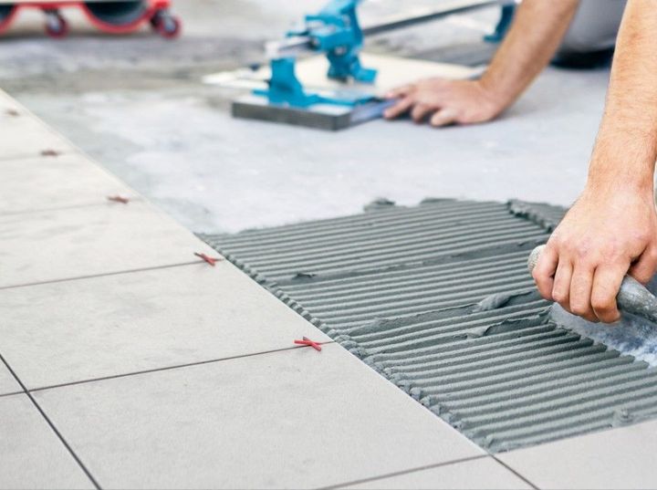 Derbyshire Tiling Specialists tiling a ceramic floor for a kitchen in Derby