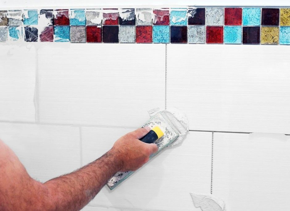 Derbyshire Tiling Specialists regrouting a bathroom wall in Derby