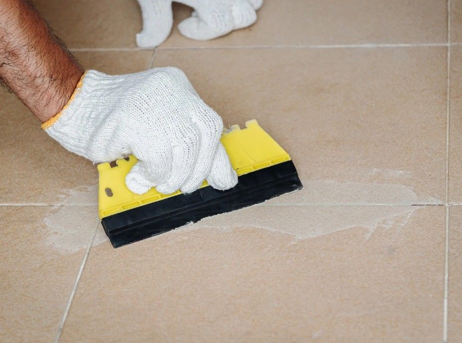 Derbyshire Tiling Specialists staining the tile grout between floor tile
