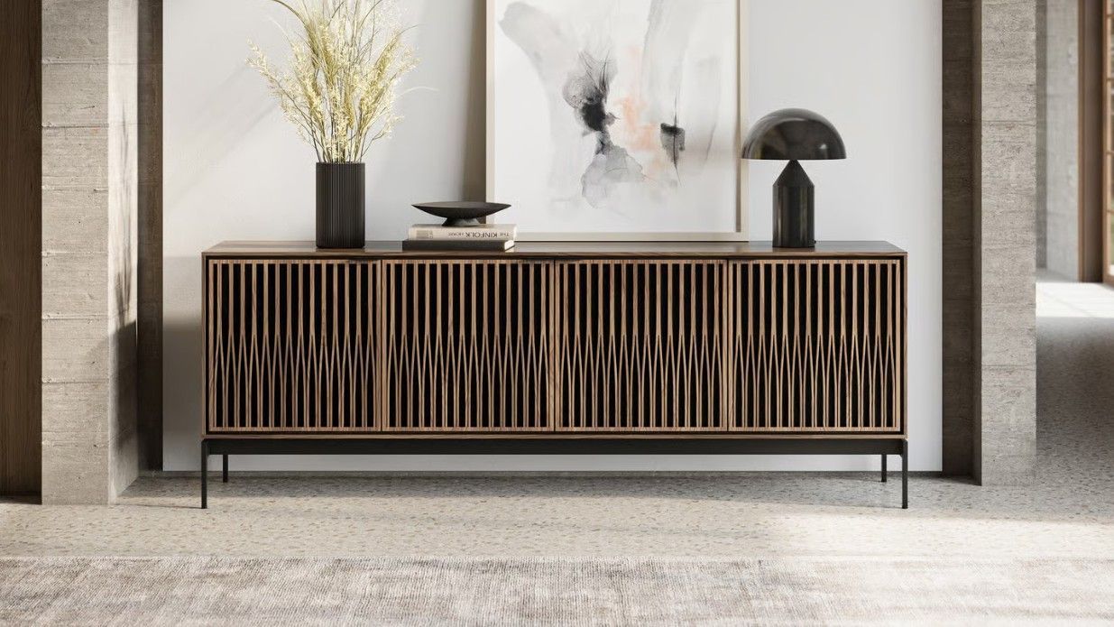 A six-drawer wooden dresser with a dark metal base and frame, featuring minimalist horizontal pulls on a white background.