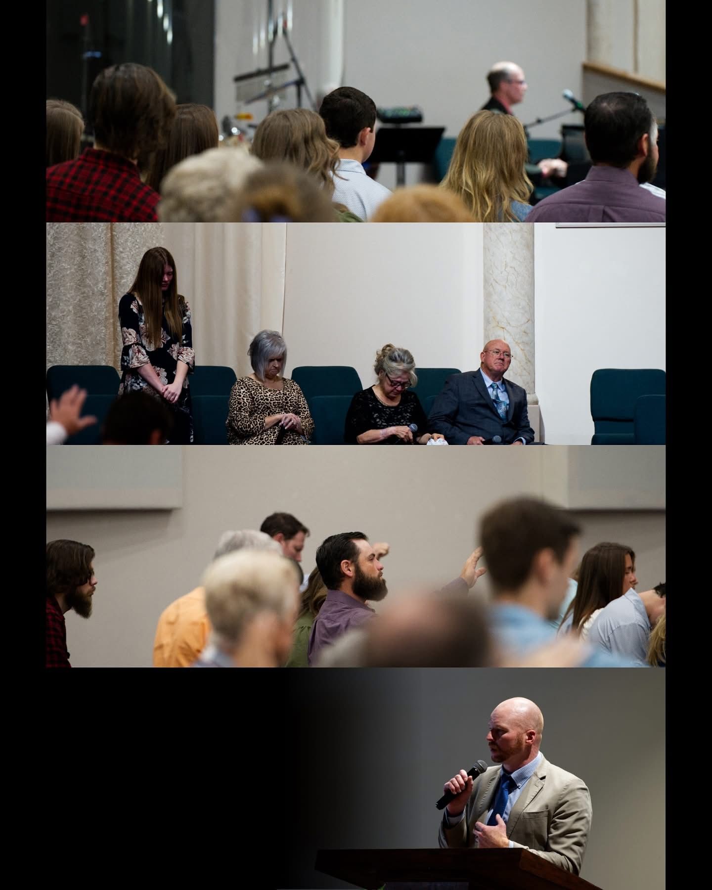 People in a church listening to a speaker, some seated, some standing, in an auditorium setting.