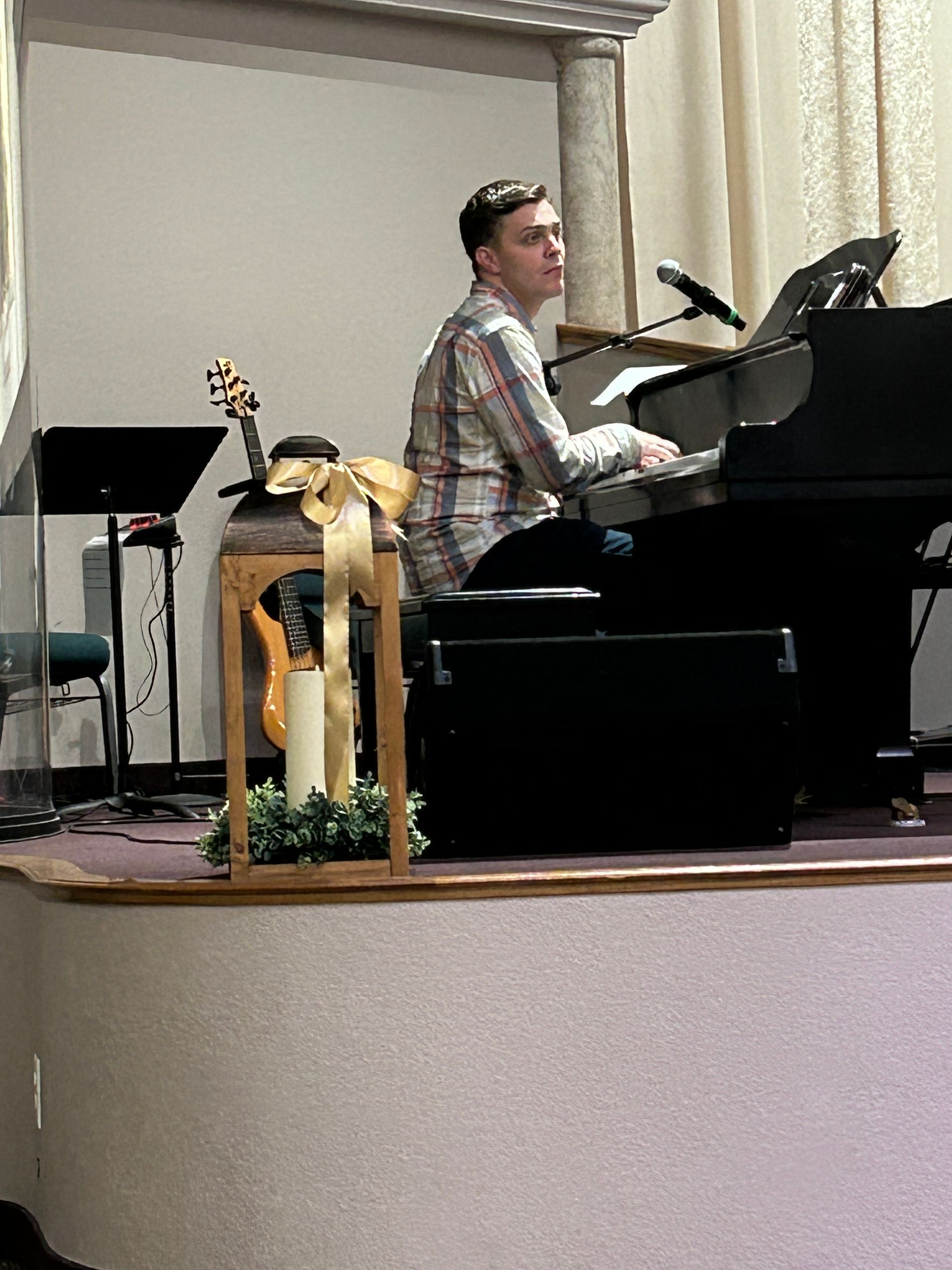 man sitting at piano