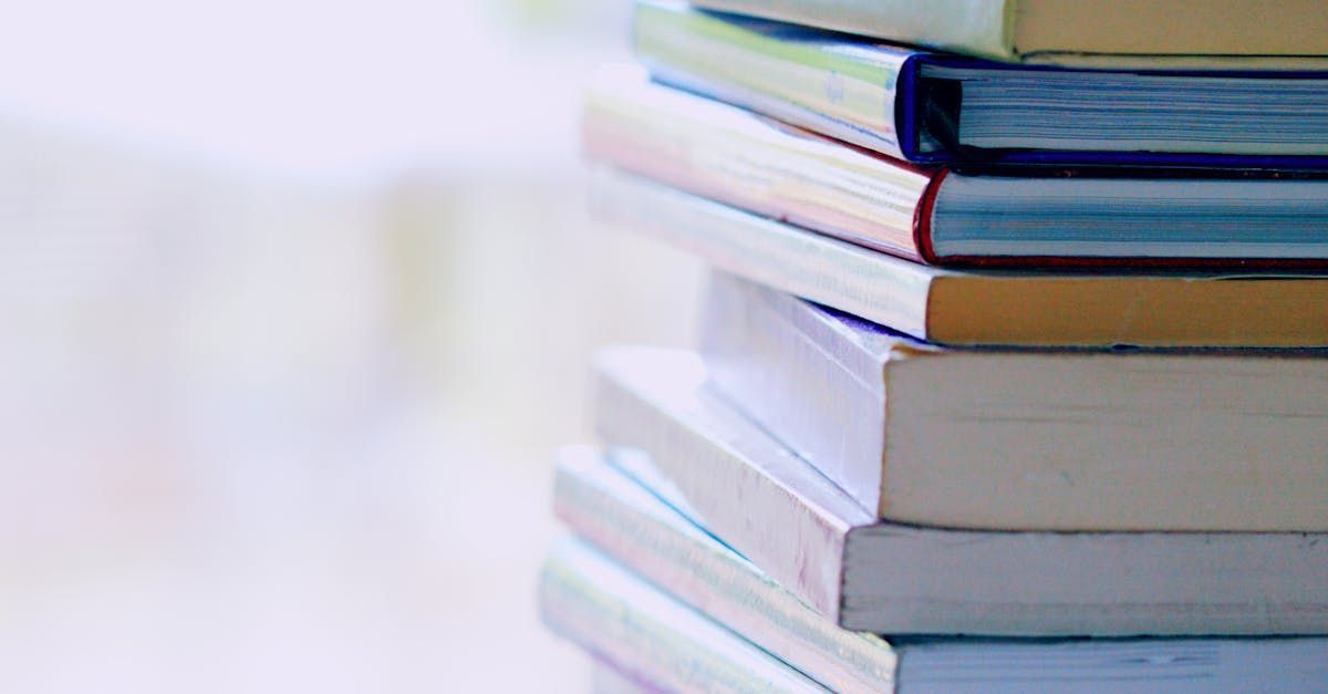 A stack of books sitting on top of each other on a table.