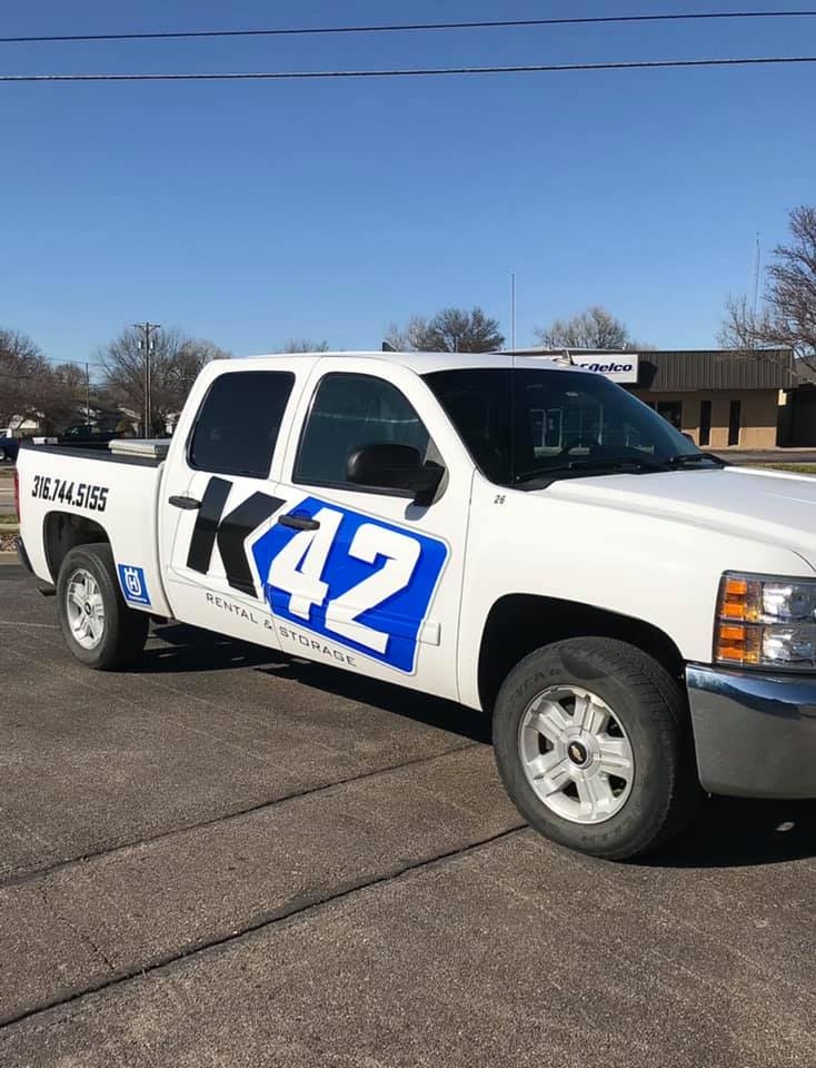 A pickup truck with vehicle graphics