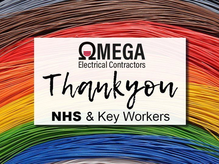 A sign that says `` thank you nhs & key workers '' is surrounded by colorful wires.