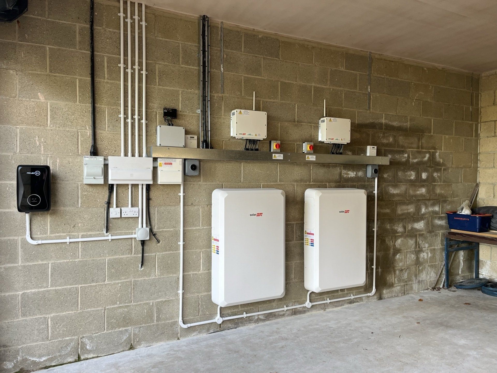 A brick wall with a bunch of white boxes on it