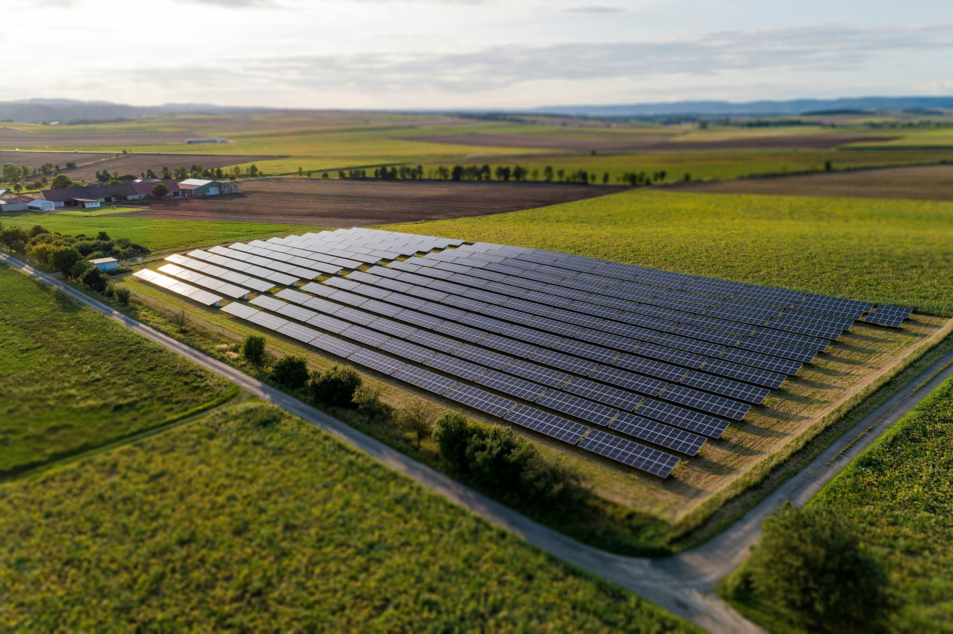 an aerial view of a large field of solar panels