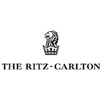 The ritz carlton logo is a black and white logo with a lion and a crown.