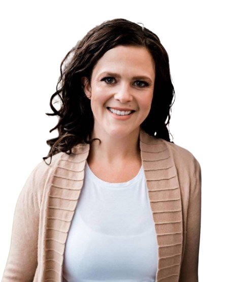 Woman with dark curly hair smiles, wearing a white shirt and beige cardigan.
