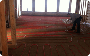 Man laying infloor heating lines