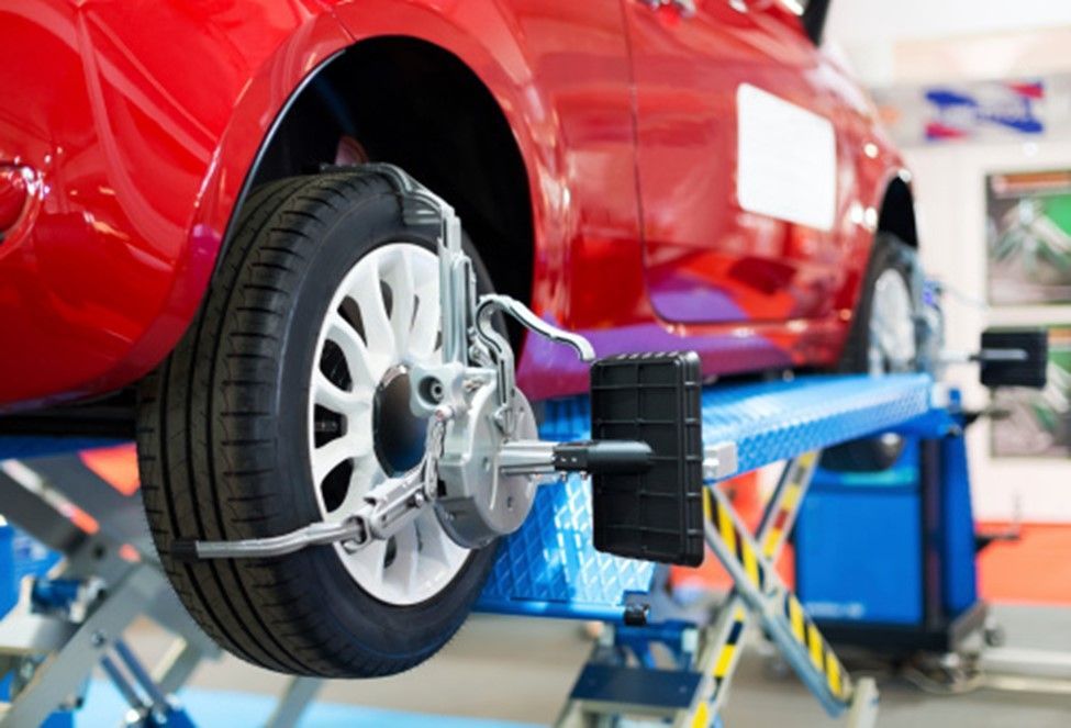 Mechanic performs preventative maintenance on car engine in Taylorsville, MD auto repair shop.
