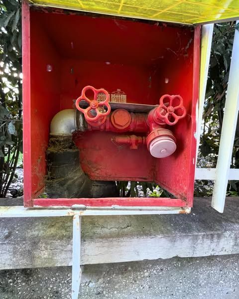 A picture of a fire hose says to break in case of fire