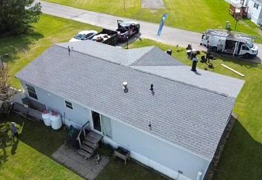 An aerial view of a house with a roof being installed.