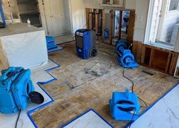 A room with a lot of blue appliances on the floor.