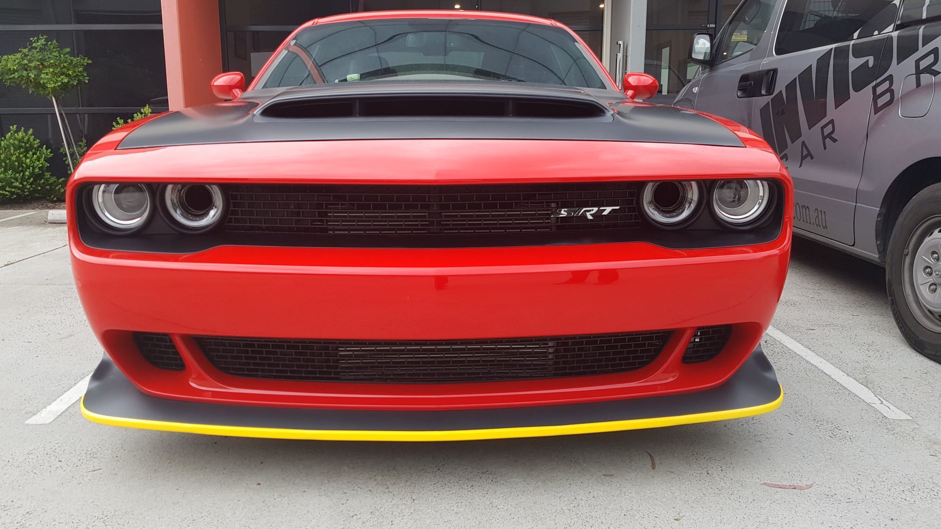 front view of a red Dodge Challenger SRT