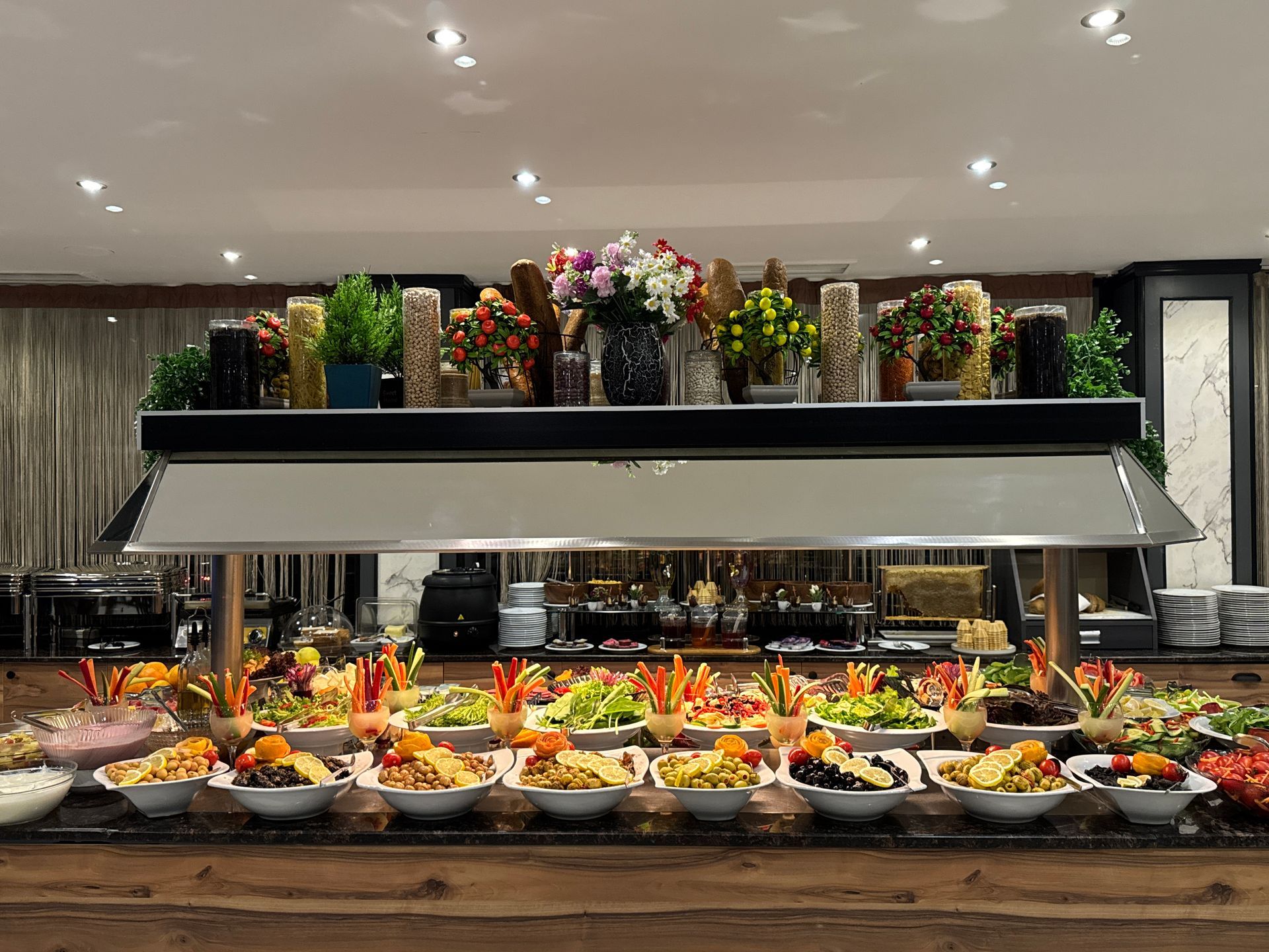 A buffet with a lot of food on it in a restaurant. | Aldino Hotel