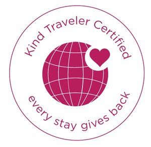 The logo for kind traveler certified every stay gives back.