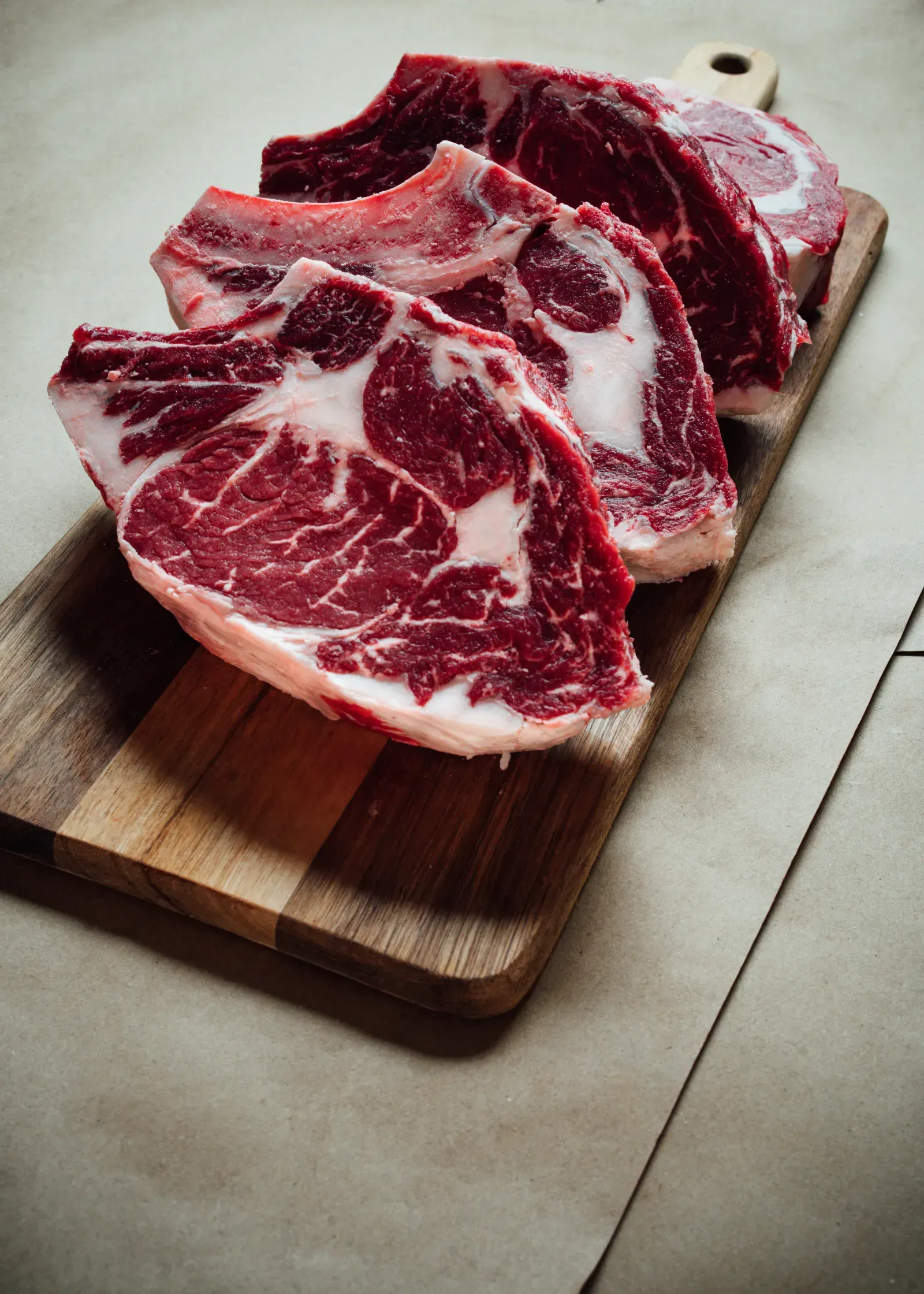 Premium brisket cut with seasoning ingredients beside it.